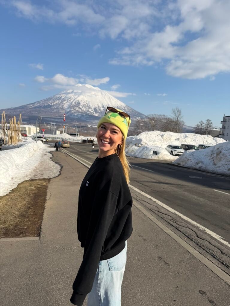 Smiling on a sunny day with Mt. Yotei behind