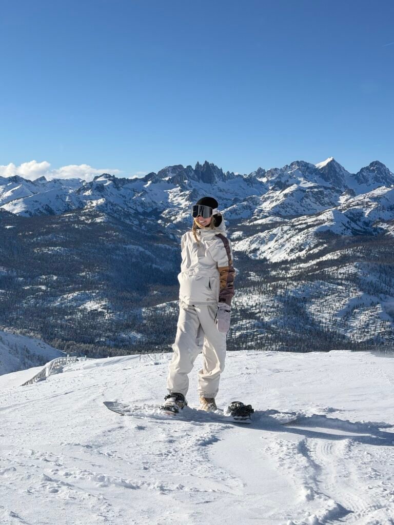 Snowboarding at Mammoth Mountain with the Sierra Nevada behind