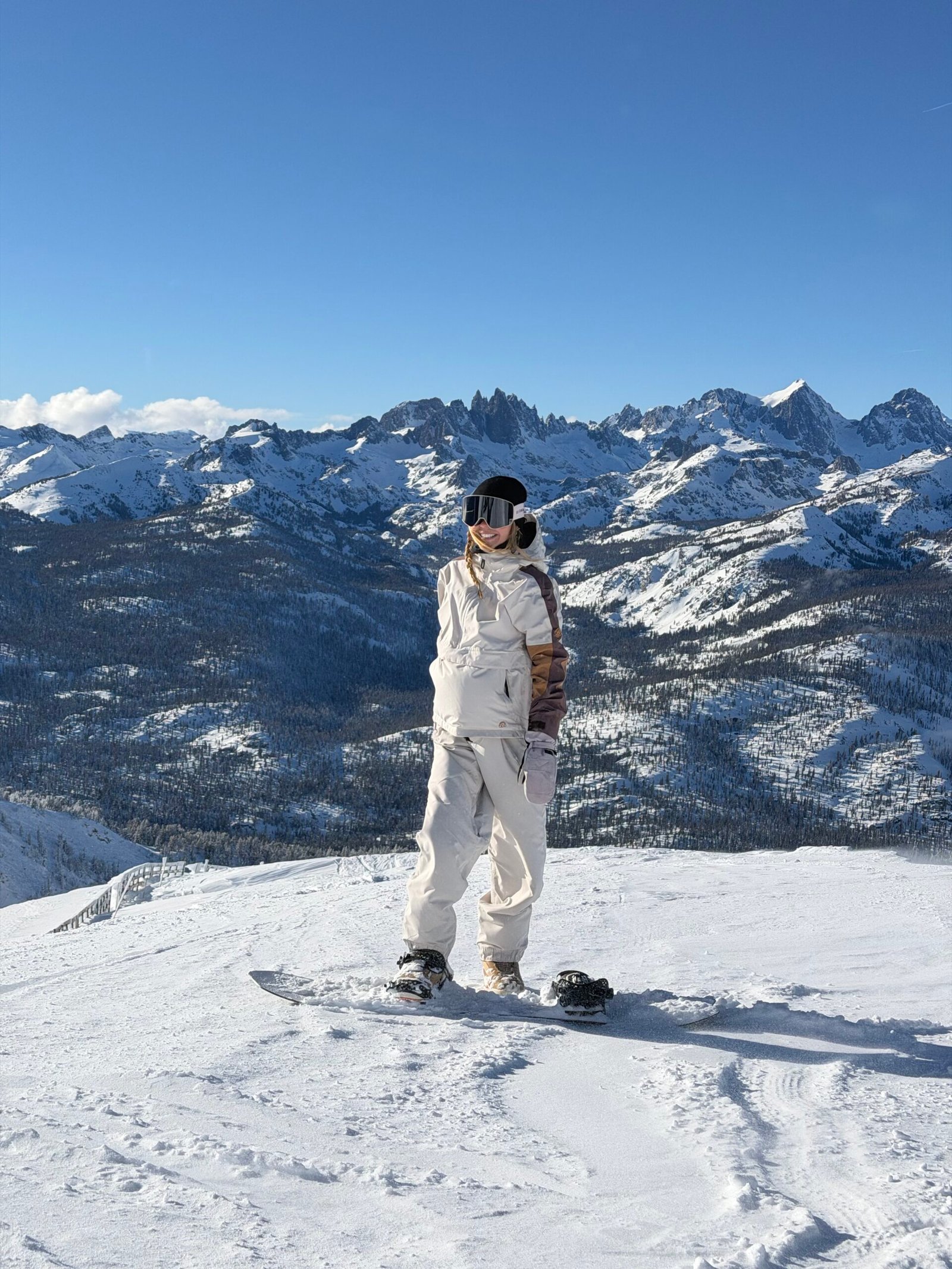 Snowboarding at Mammoth Mountain with the Sierra Nevada behind