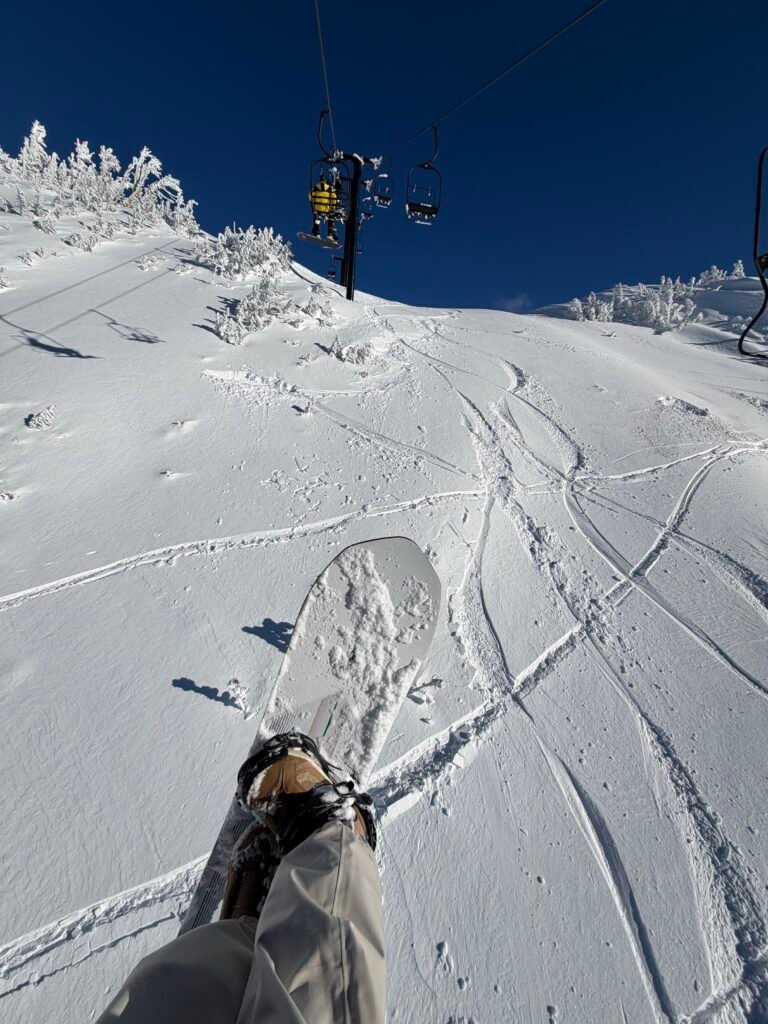 Riding down a groomed run at Mammoth on my snowboard