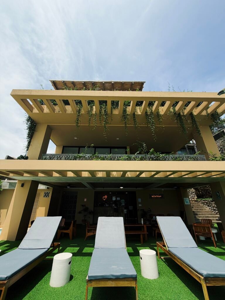 Pool deck with lounge chairs in El Zonte