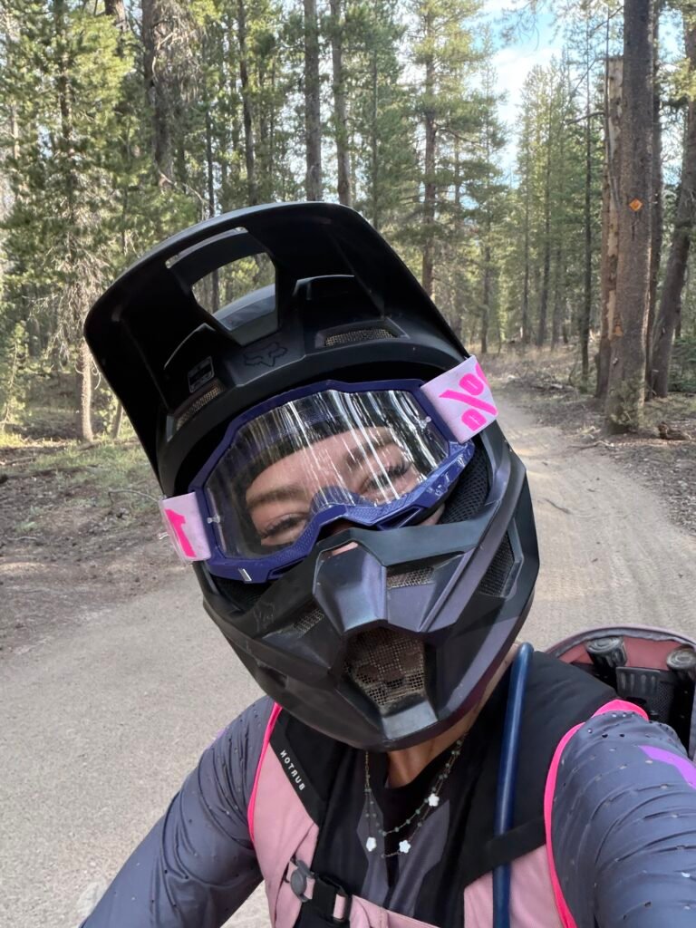 Helmet selfie with goggles on a forest trail near Mammoth