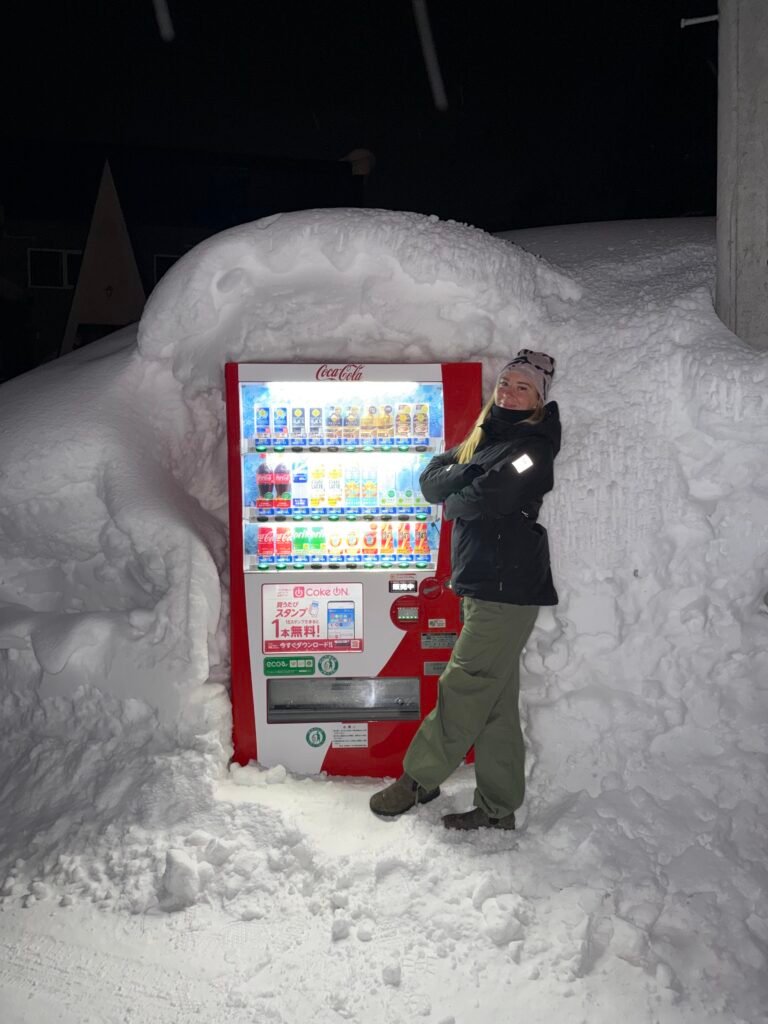 Vending machine almost buried in snow