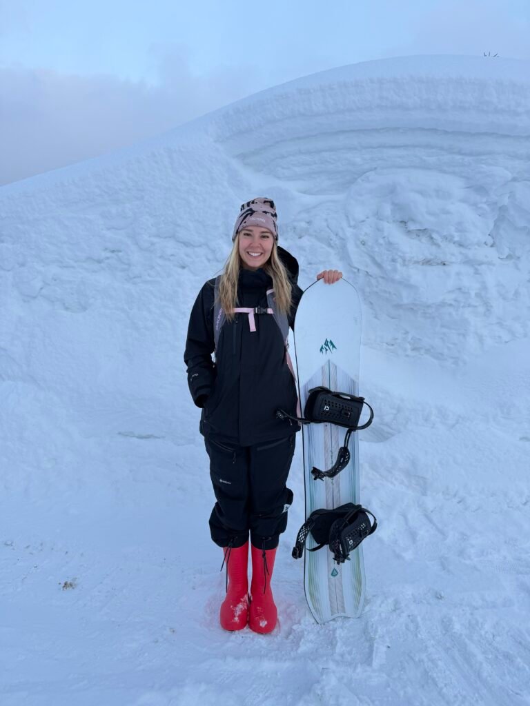 Me in my red Fubuki boots next to a wall of snow