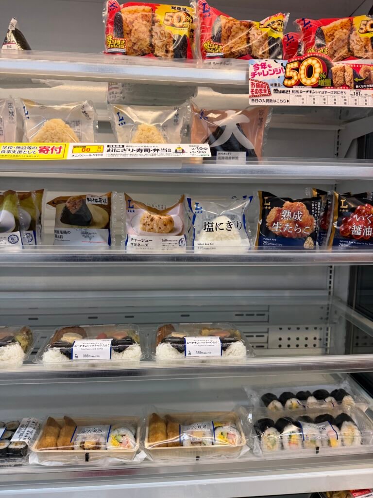 Convenience store shelves packed with sandwiches and snacks