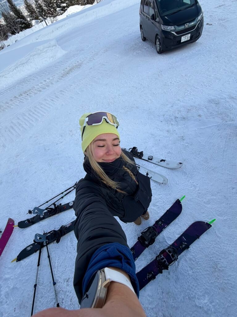 Taking a rest in the snow on the backcountry tour