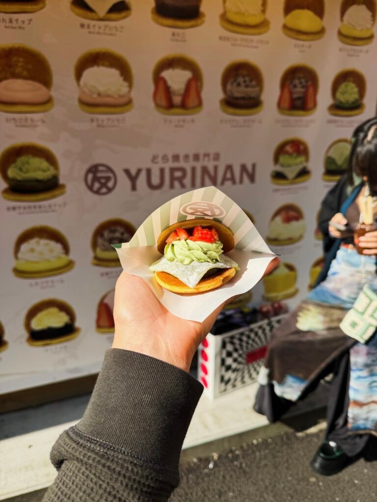 Holding a burger in Tokyo