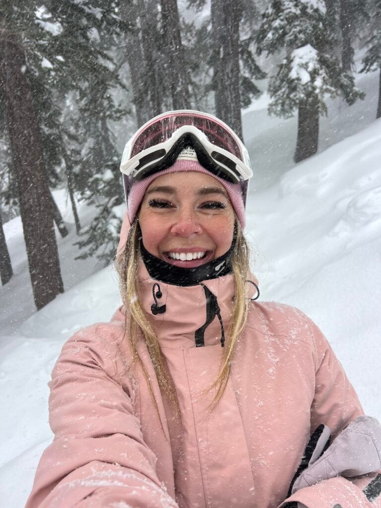 Pink jacket and goggles on a snowy day at Mammoth