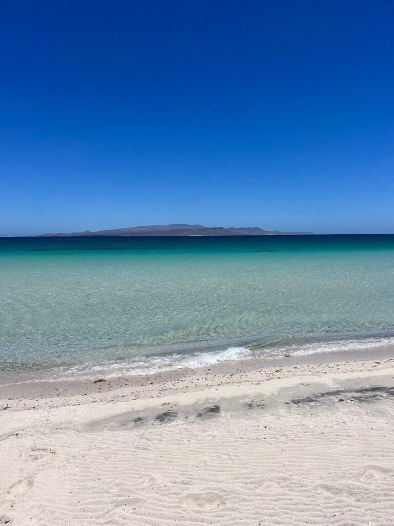 White sand and calm water at El Tecolote Beach