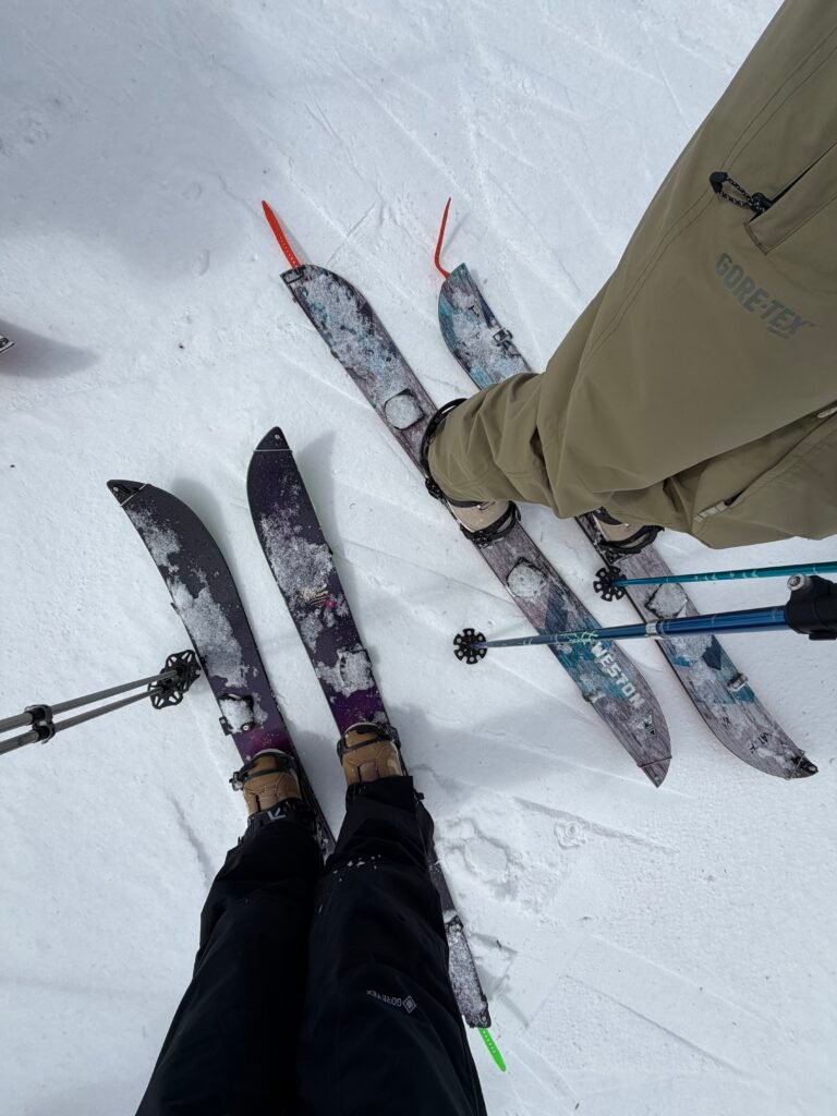 Looking down at skis and poles on the backcountry day