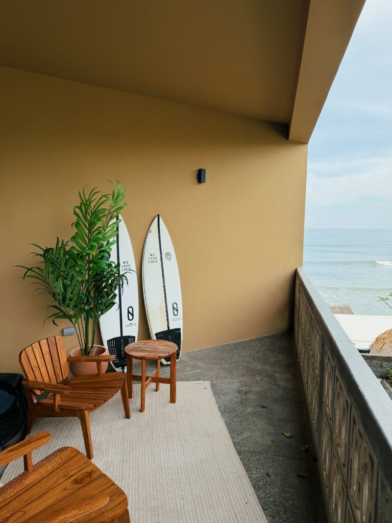 Balcony with surfboards and an ocean view