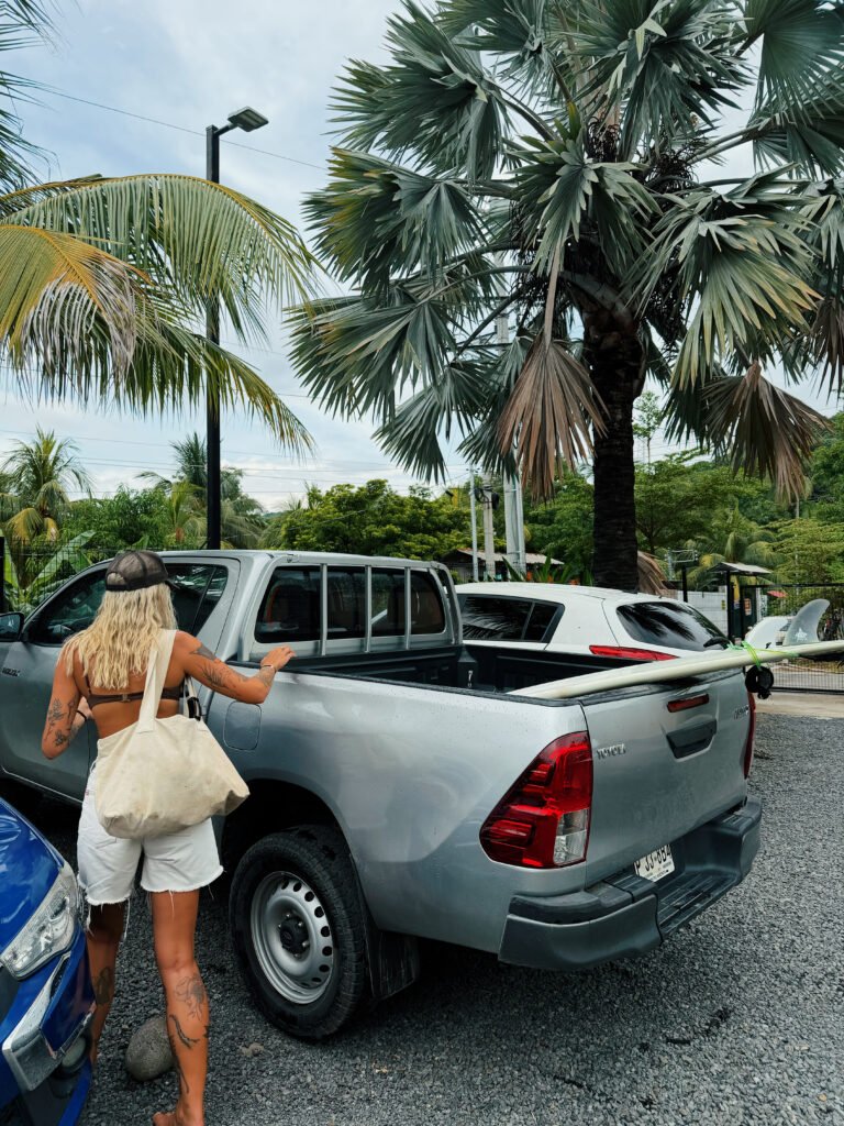 Loading surfboards into a pickup truck in El Salvador