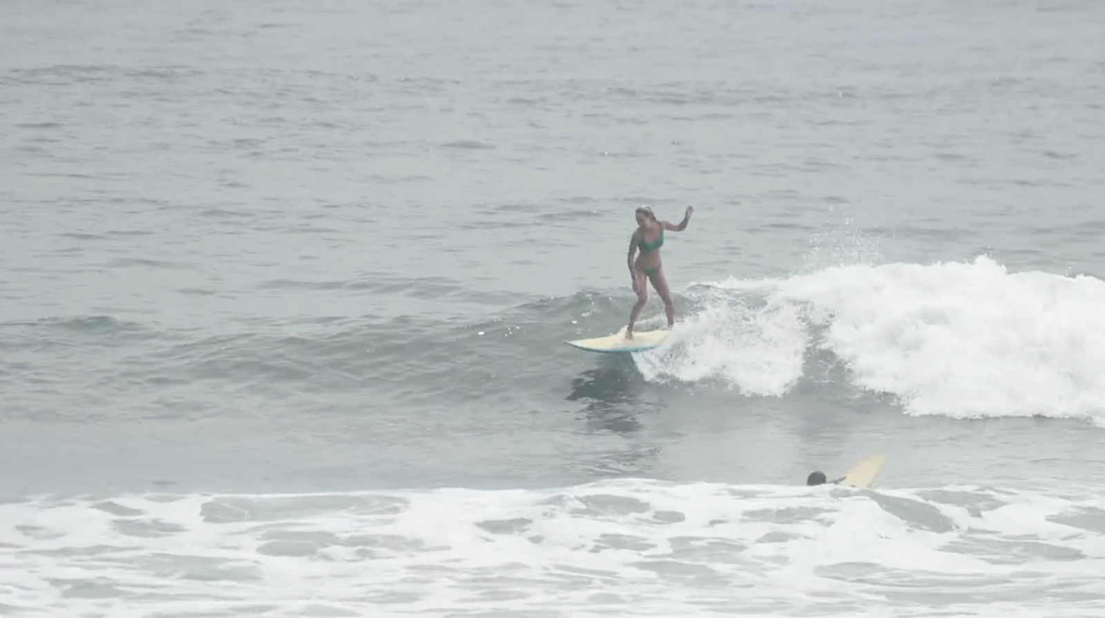 Riding a wave at the break in El Zonte